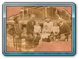 I believe this is Henry Carter and Sarah Loundia (Reeves) Reynolds - center, possibly James R. Reynolds on left - not sure of the rest?